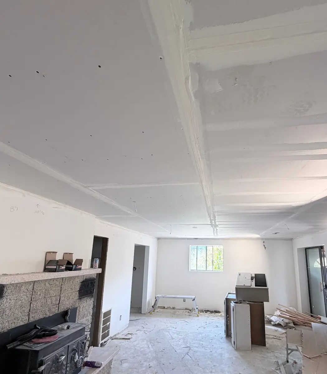 Basement ceiling with taped seams and first coat of compound